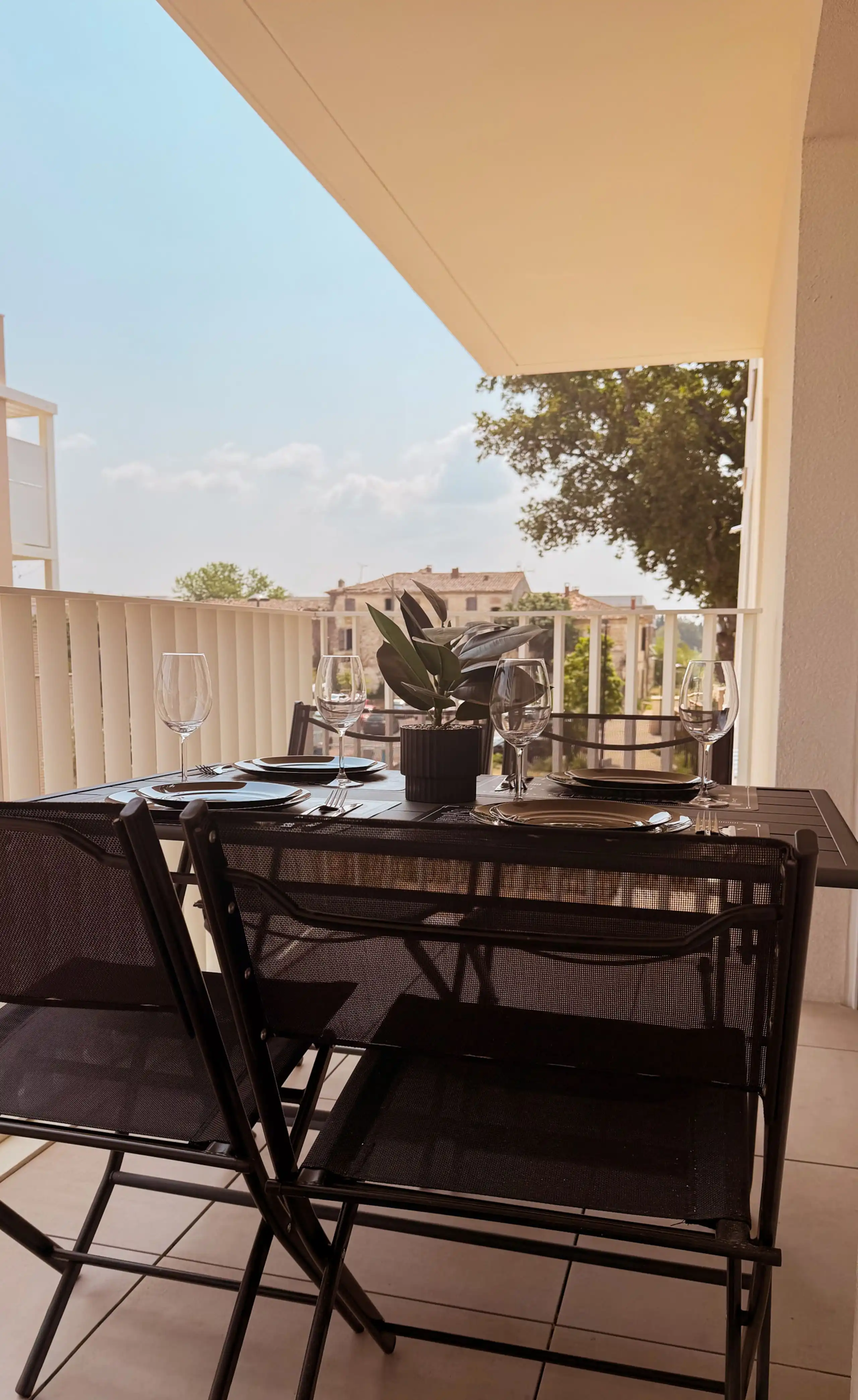 The furnished balcony at Nakama House with table and chairs, in Monteux, Provence — photo 1