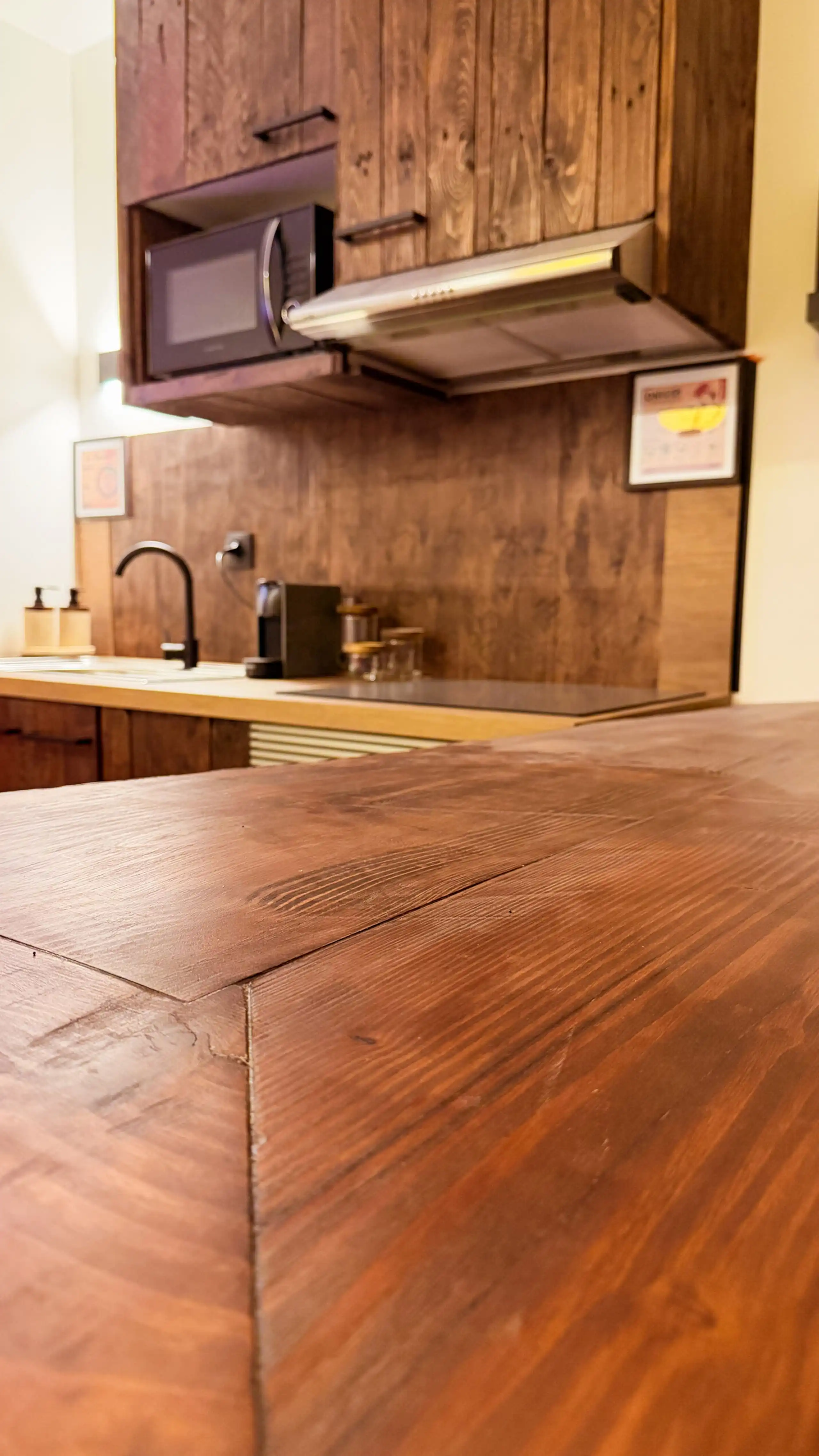 The fitted kitchen at Nakama House with its made-to-measure solid wood worktop — photo 1
