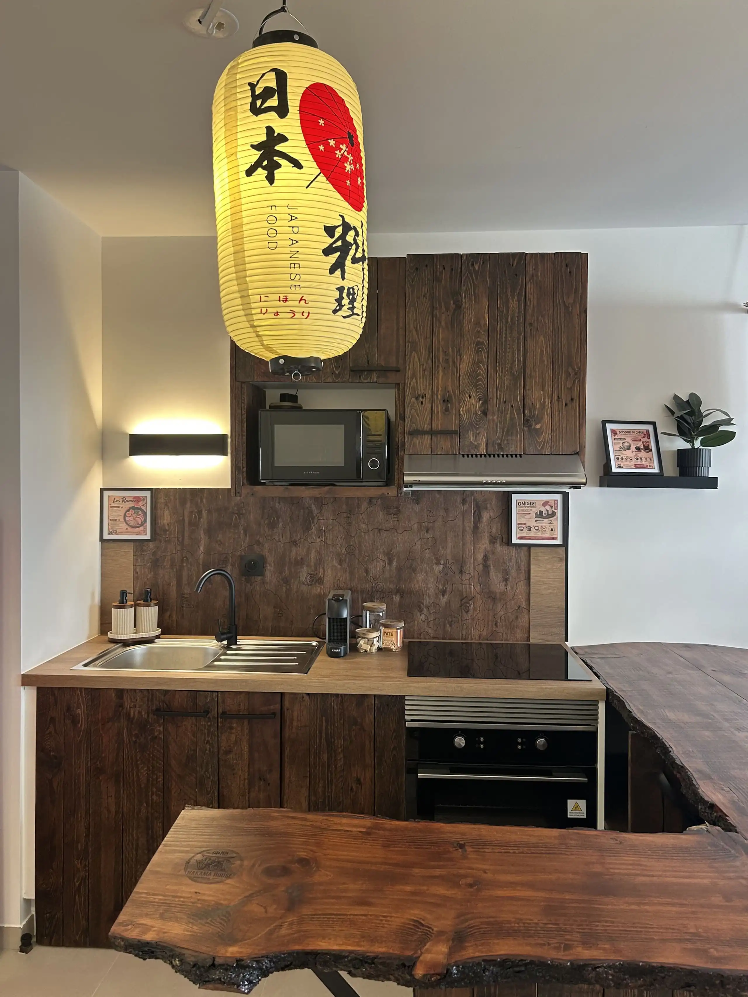 The fitted kitchen at Nakama House with its made-to-measure solid wood worktop — photo 8
