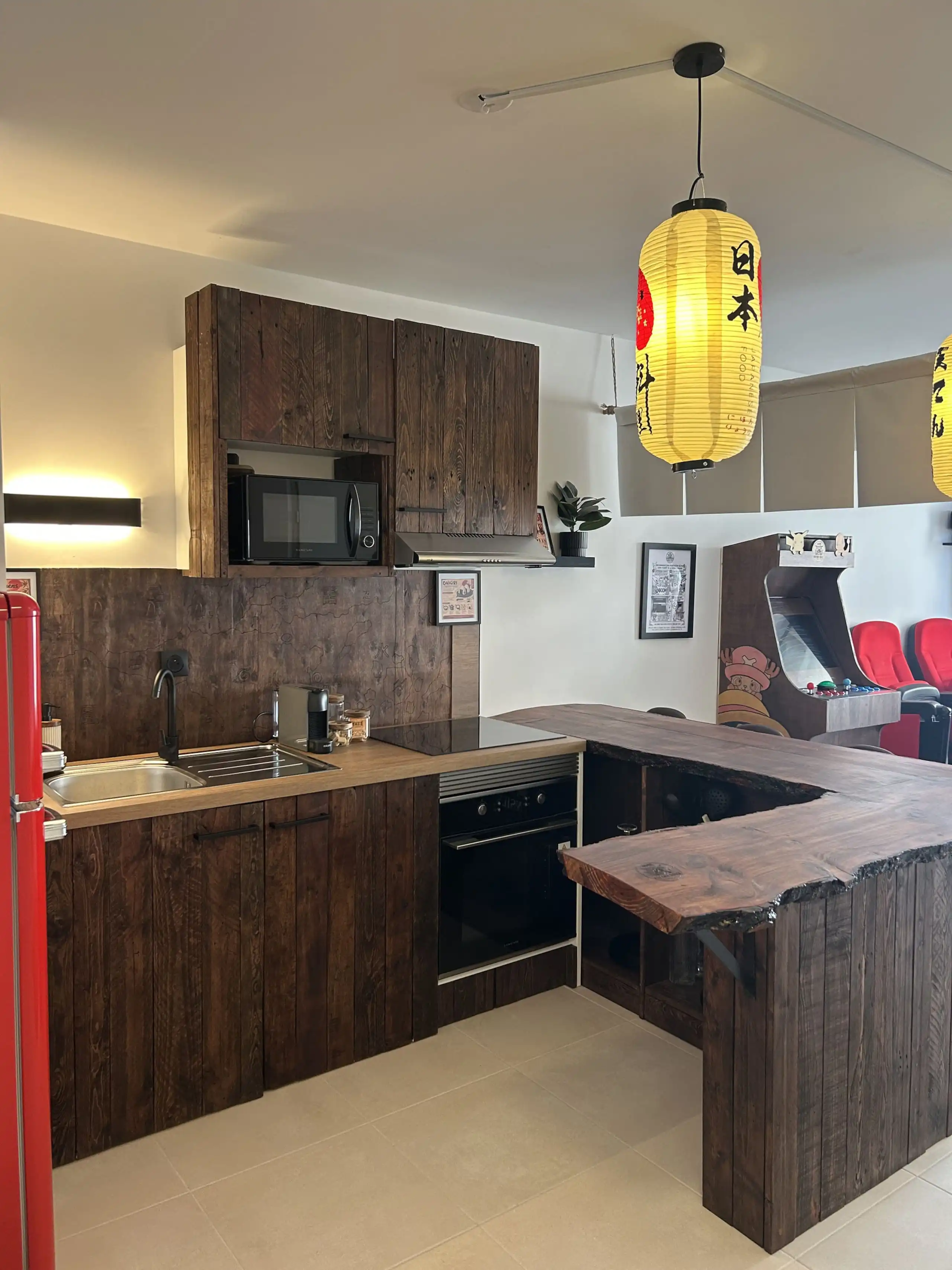 The fitted kitchen at Nakama House with its made-to-measure solid wood worktop — photo 9